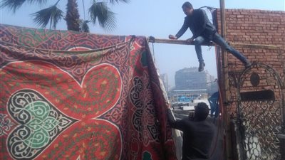 صور| لليوم الثاني على التوالي.. حي العجوزة يستكمل إزالة الساتر القماش المخالف بنادي الزمالك