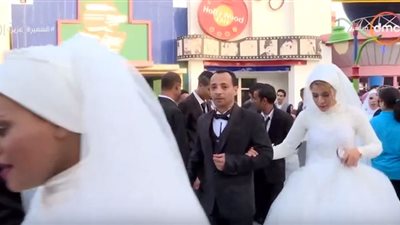 فيديو| وفود عربية تشارك في حفل زفاف جماعي لـ 12 عريس وعروسة من الأيتام