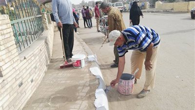 صور| حملة نظافة بالأحياء لرصف شوارع قلين فى كفر الشيخ