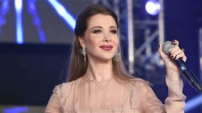 شاهد.. نانسي عجرم بـ رفقة زوجها 