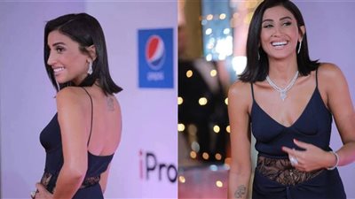 وشم دينا الشربيني في مهرجان الجونة السينمائي يغطي على إطلالتها .. ما علاقته بعمرو دياب؟