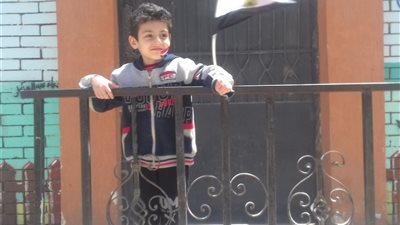 رسم الأعلام على وجوه أطفال الإسكندرية بالاستفتاء على تعديلات الدستور